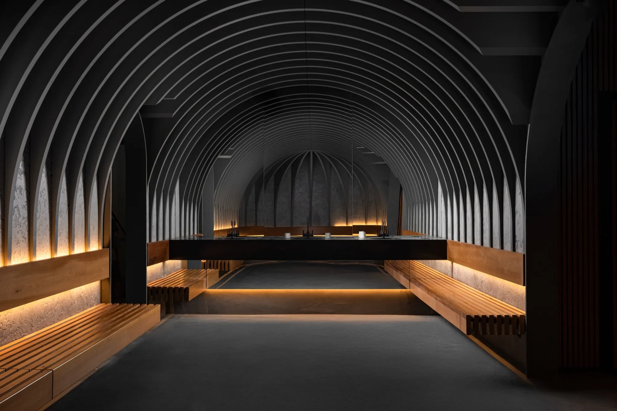 The arched lounge at NRG Haus with warm lighting