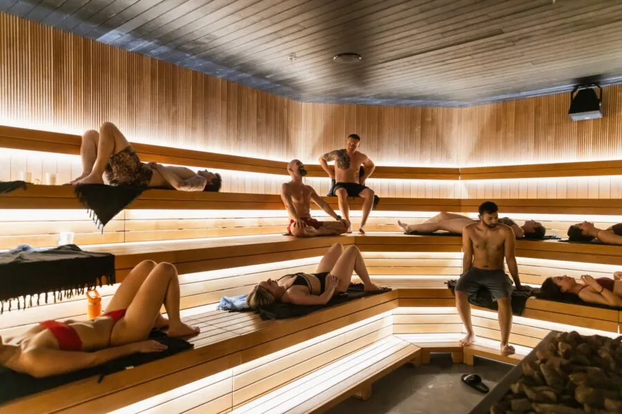 Guests relaxing on the tiered benches of the NRG Haus sauna